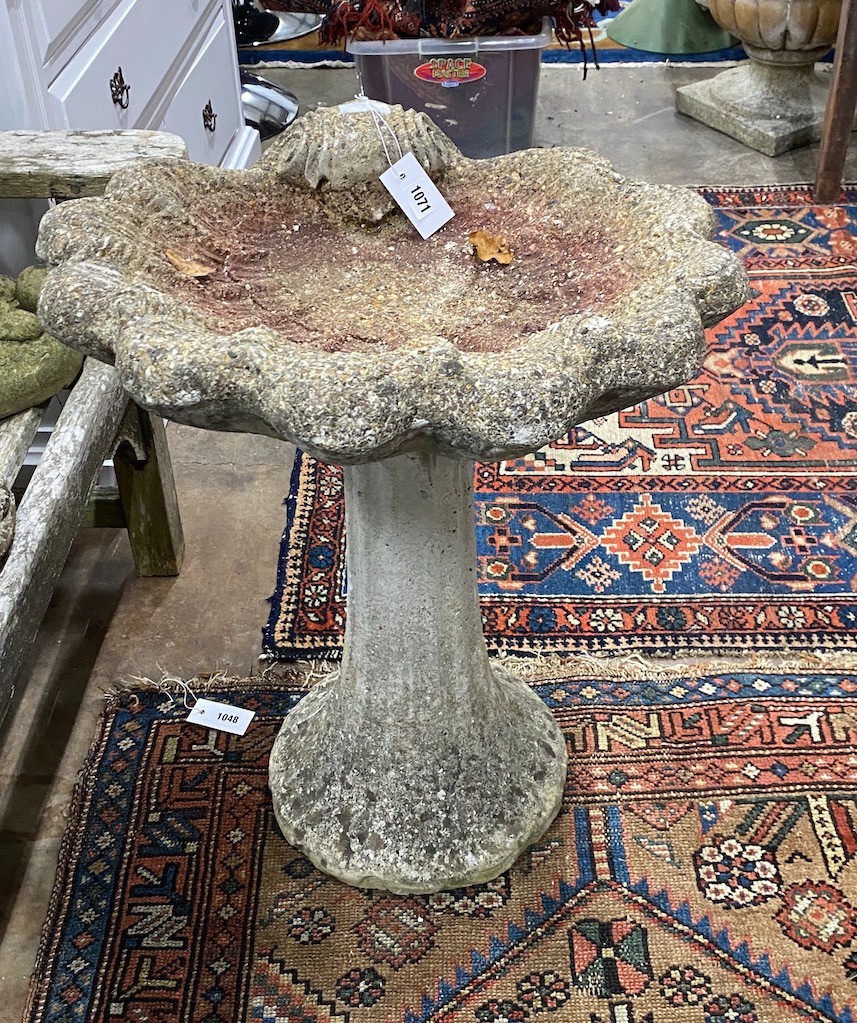 A reconstituted stone bird bath, width 55cm height 69cm
